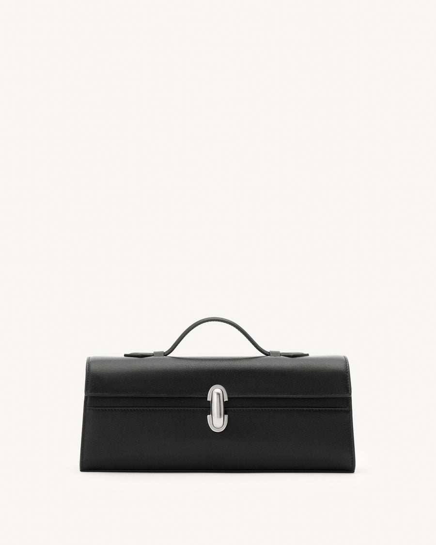 front view of vintage black leather top handle bag with matte silver clasp on a white background 