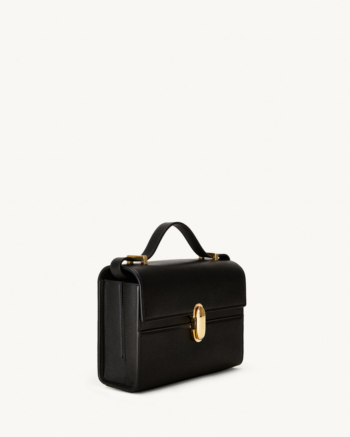 side view of a black leather bag with a gold clasp on a white background