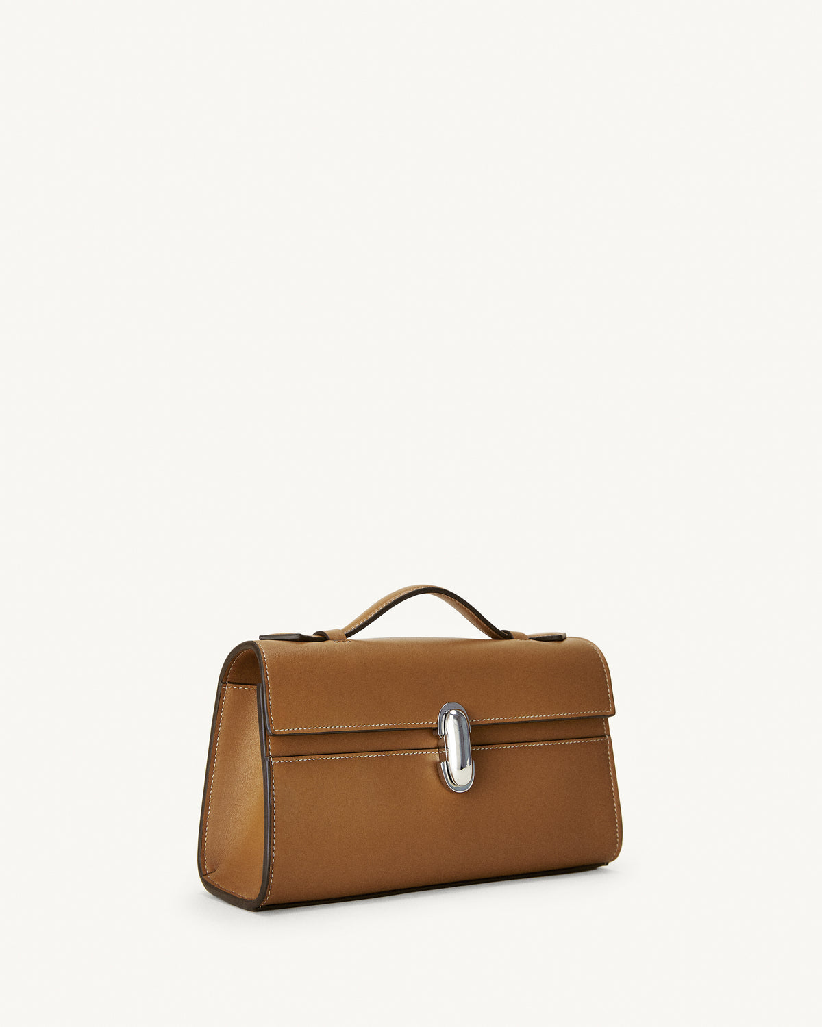 side view of a saddle brown leather bag with a silver clasp on a white background