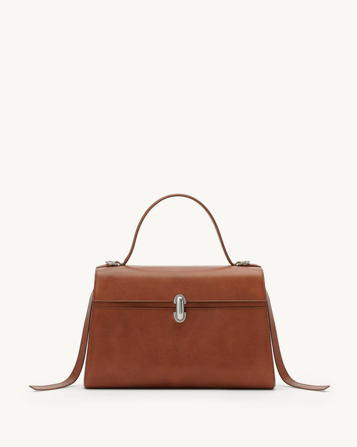Front view of a cognac brown leather bag with a silver clasp on a white background 