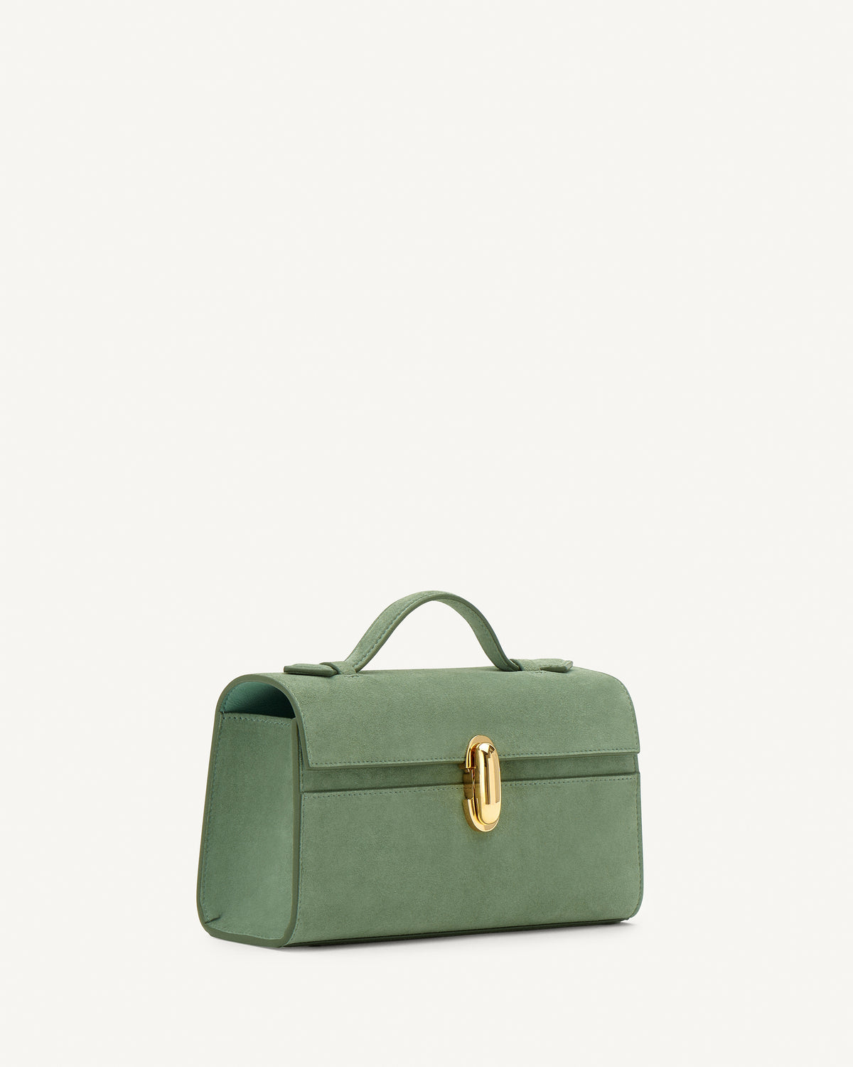 Side view of cactus suede top handle handbag with gold hardware