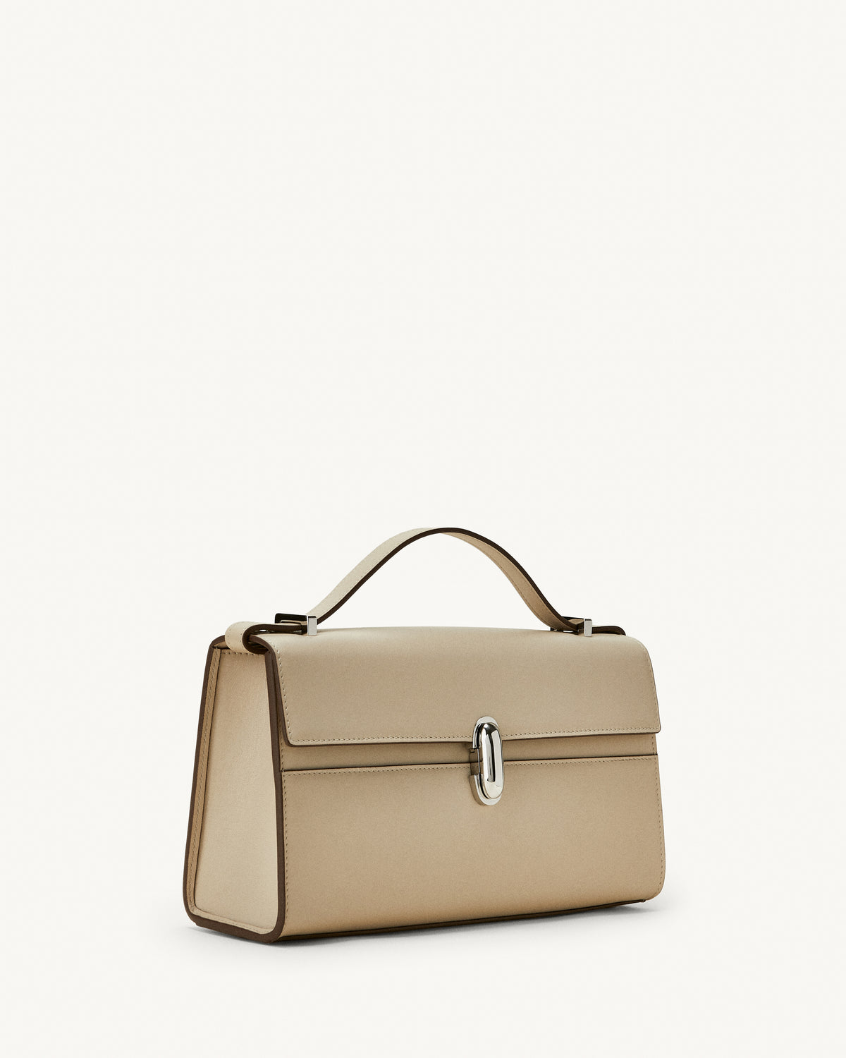 side view of a bone beige leather bag with a silver clasp on a white background