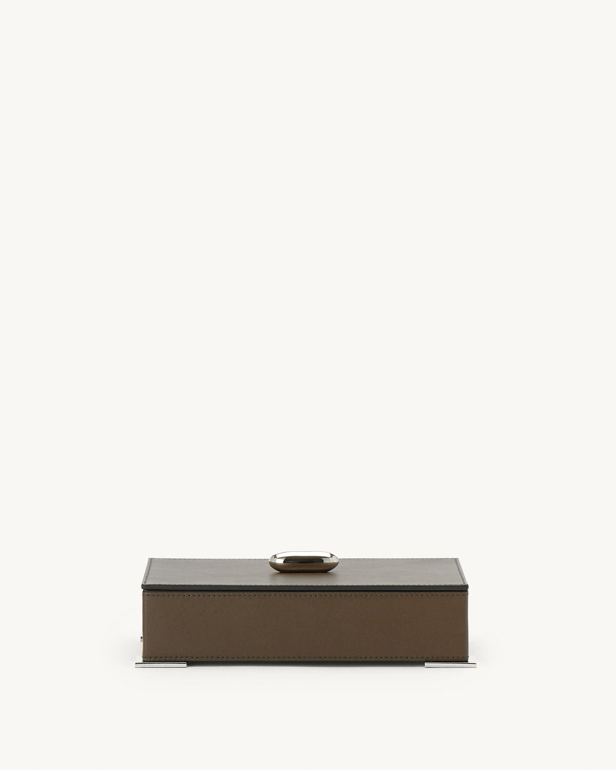front view of a mink brown leather box with silver hardware on a white background