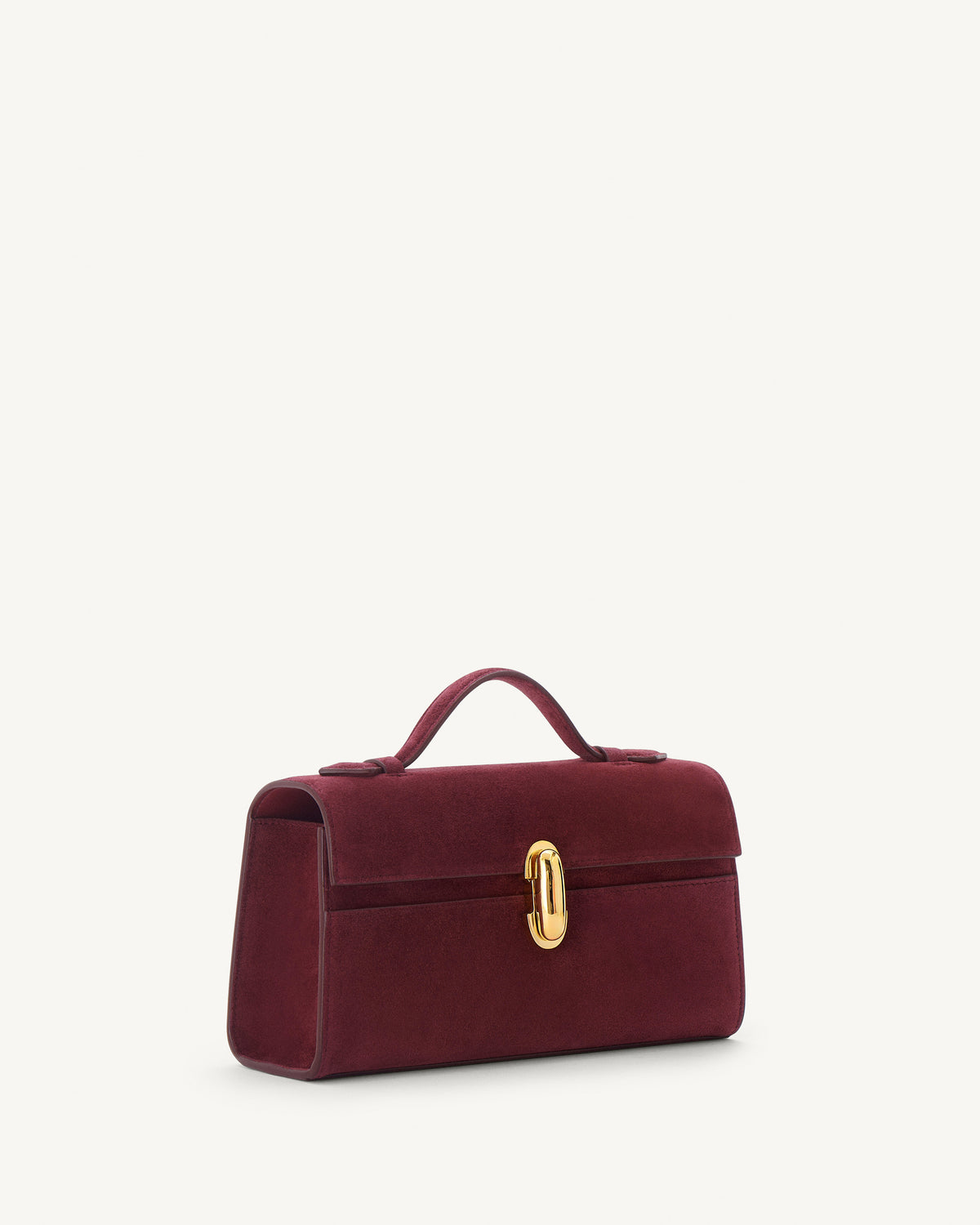 side view of a plum red suede bag with gold clasp on a white background