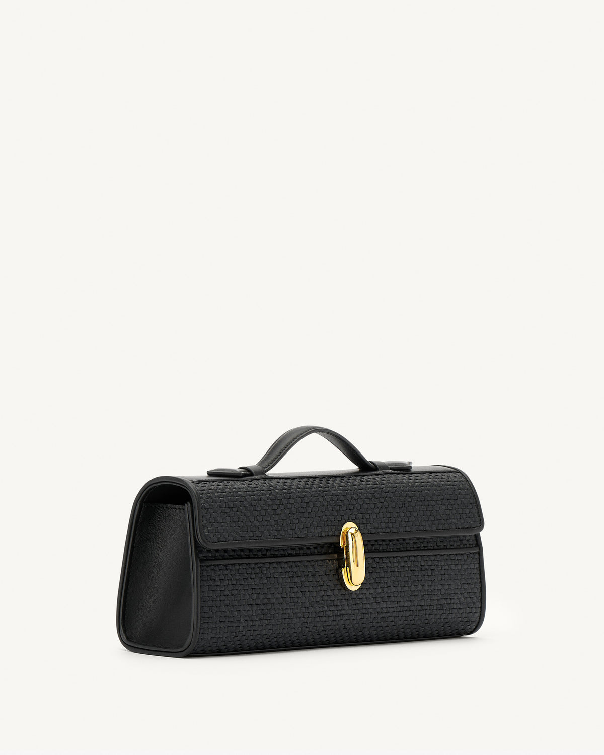 side view of a black raffia bag with leather trim with a gold clasp on a white background