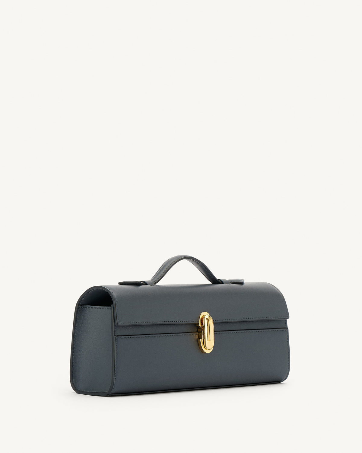 side view of a storm blue leather bag with a gold clasp on a white background