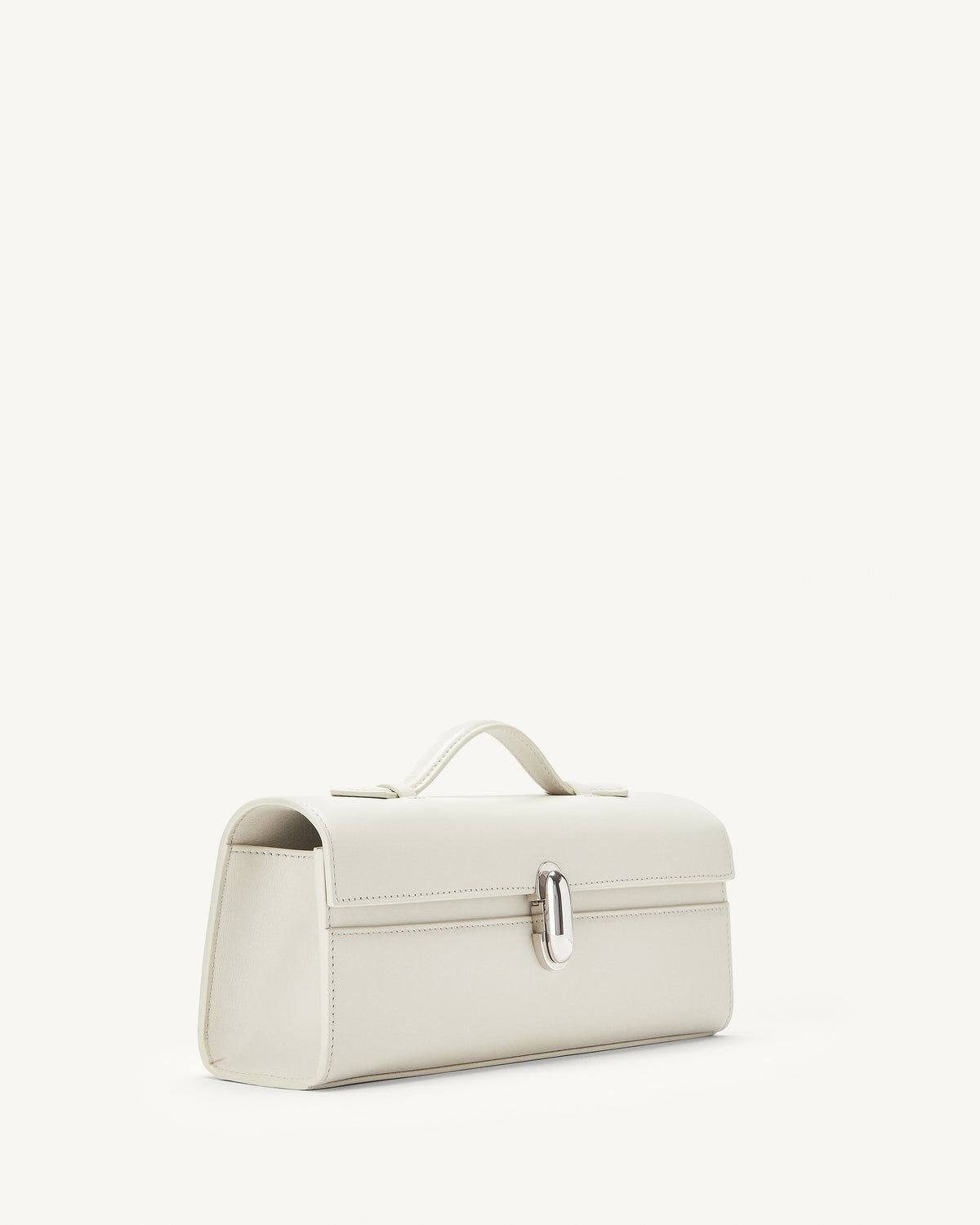 side view of ivory bag with silver clasp on a white background