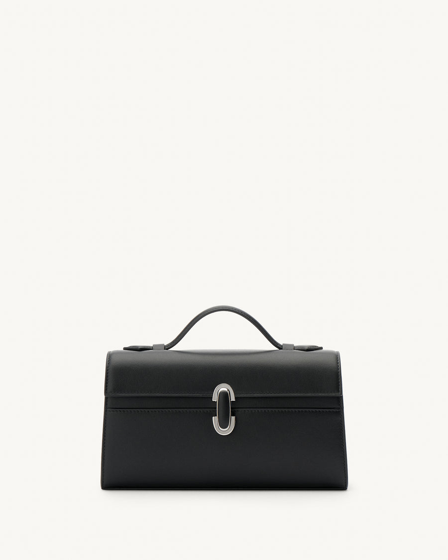 front view of a black leather top handle bag with a black leather covered silver clasp on a white background