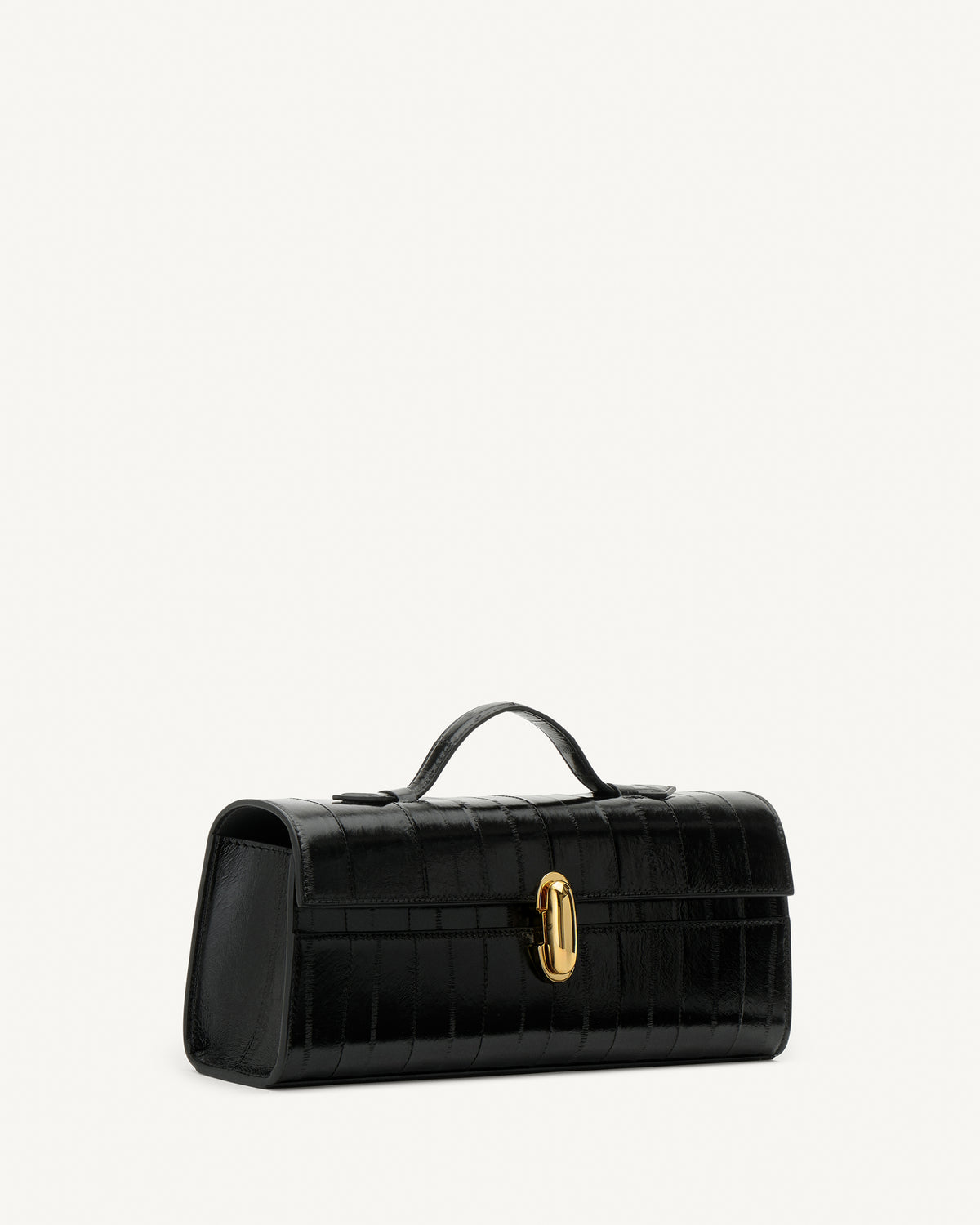 side view of a black eel bag with a gold clasp on a white background