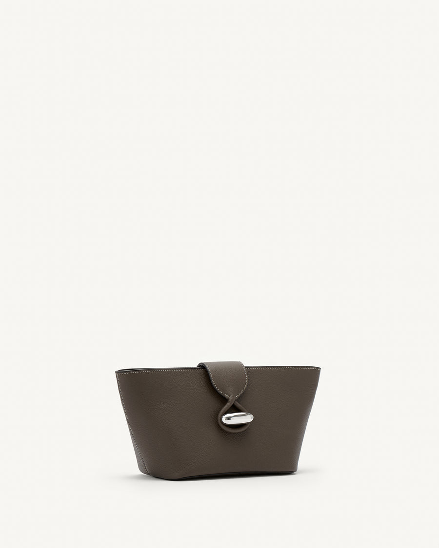 Side view of mink leather pouch with silver hardware