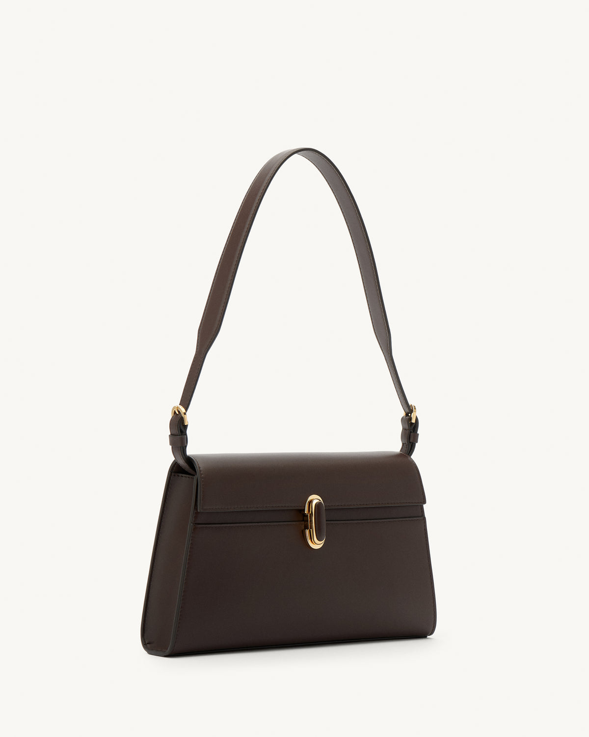 side view of a coffee brown leather shoulder bag with a leather covered gold clasp on a white background 
