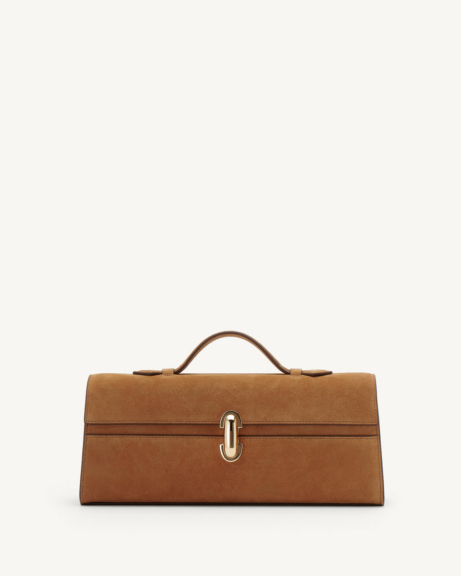 Front view of Saddle Suede leather handbag with a silver clasp on a white background