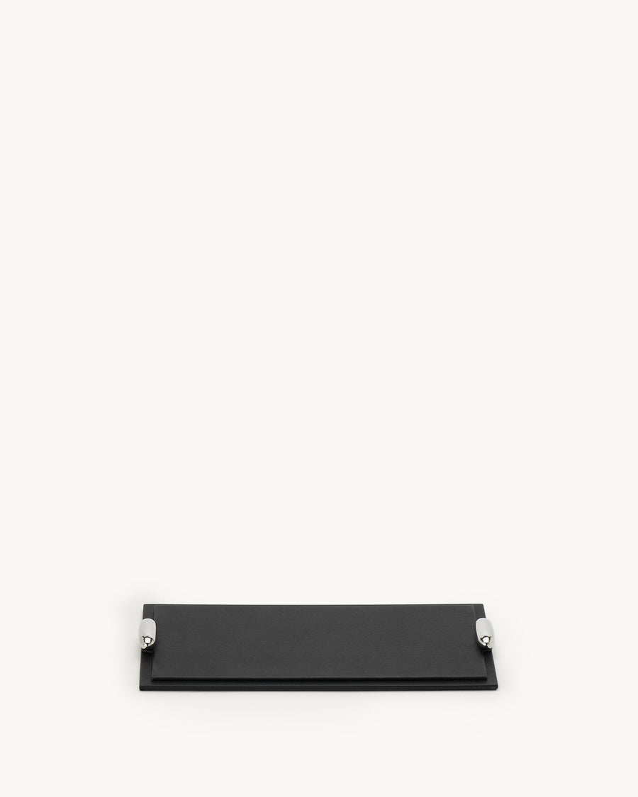 front view of an ebony black leather tray with silver metal hardware on a white background