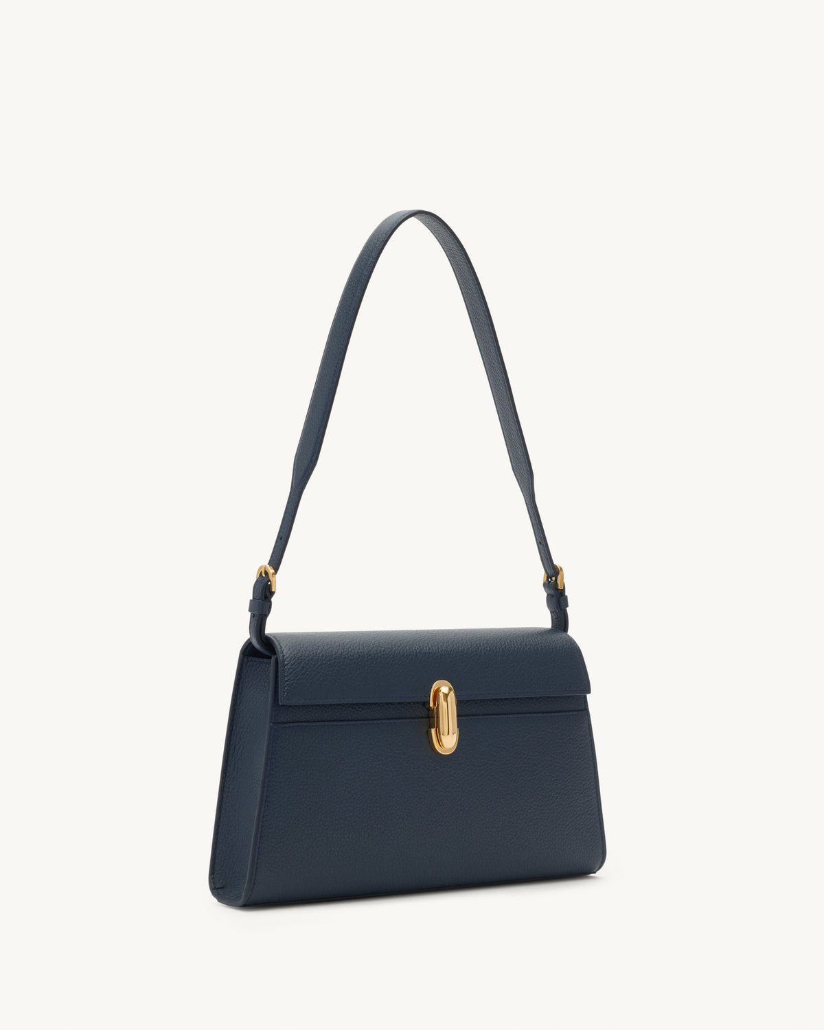 side view of navy blue bag with gold clasp on a white background