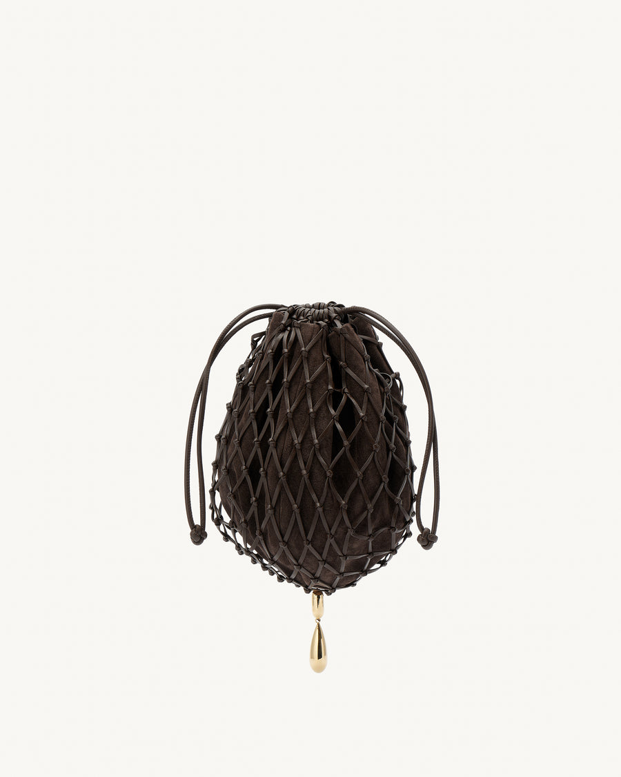 front view of a coffee brown macrame woven clutch bag with leather drawstring and a gold hardware piece at the bottom on a white background 