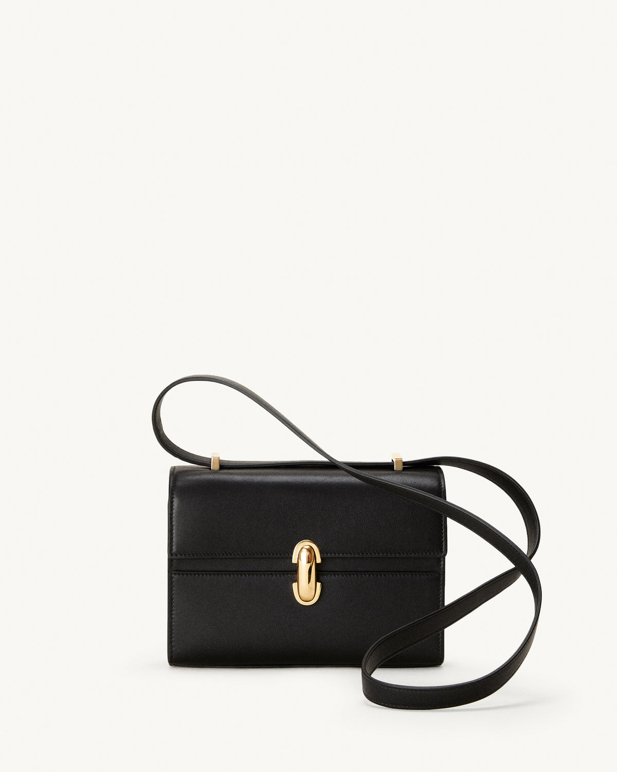 front view of a black leather bag with a gold clasp on a white background