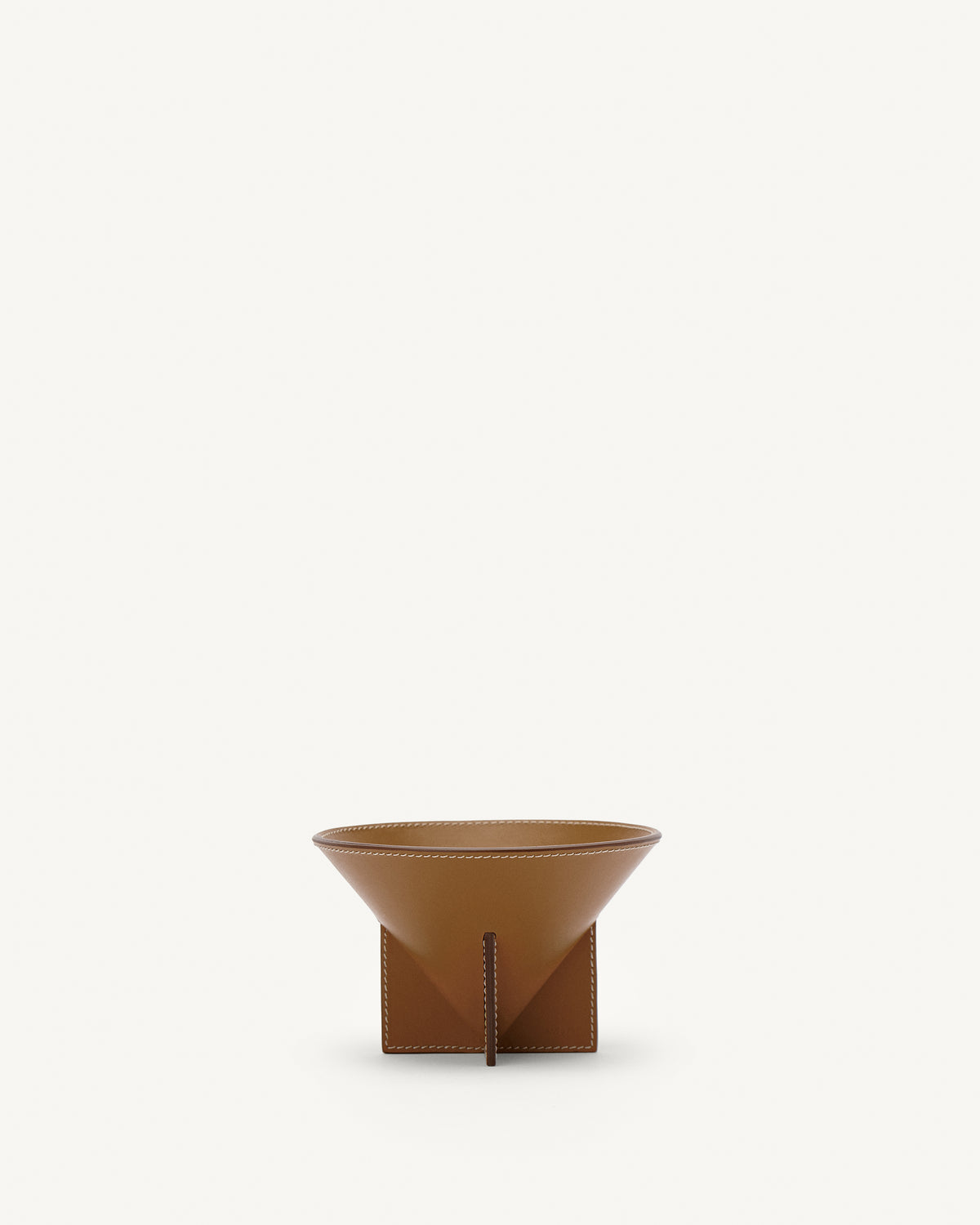 front view of saddle brown leather dish on a white background