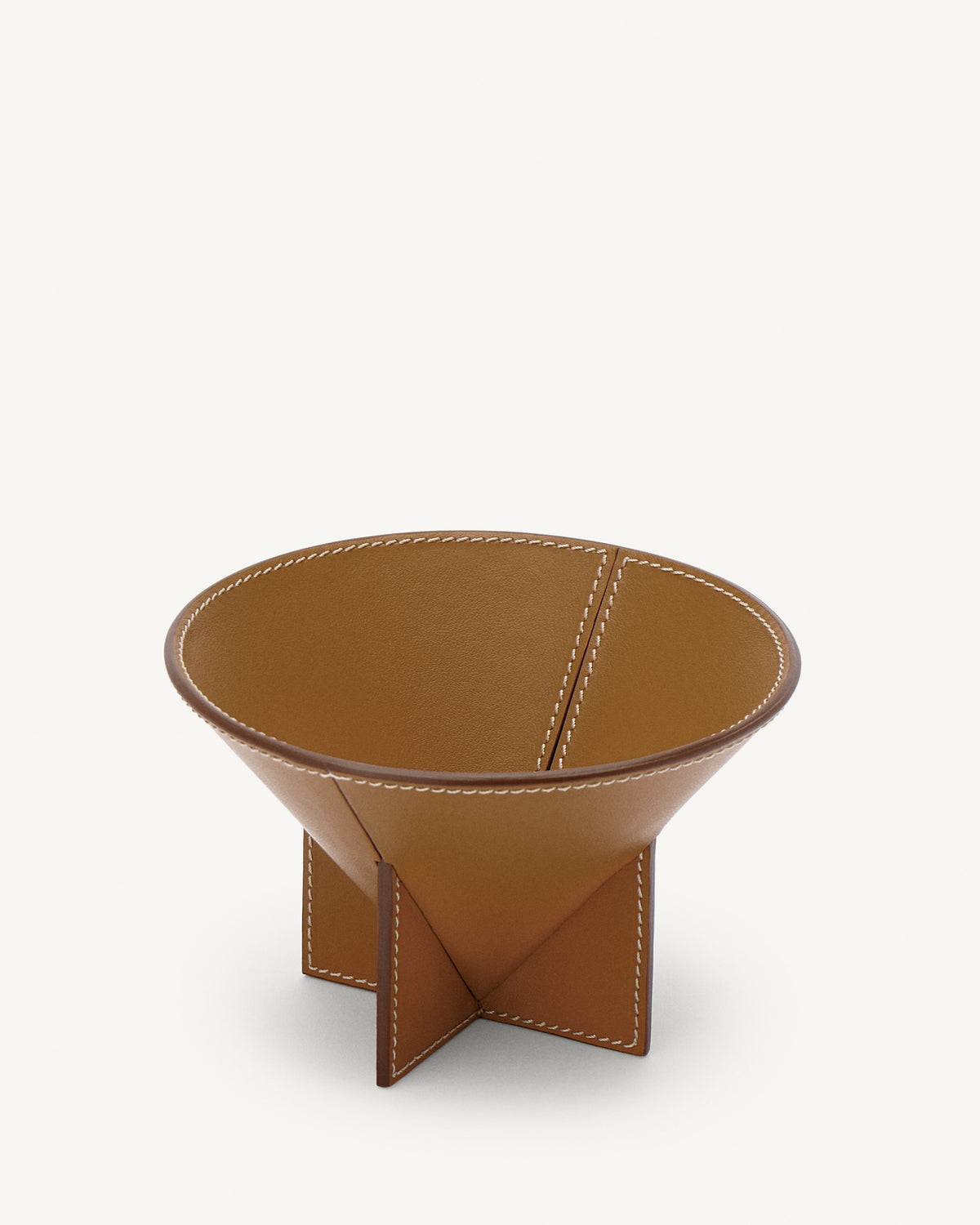 interior view of saddle brown leather dish on a white background