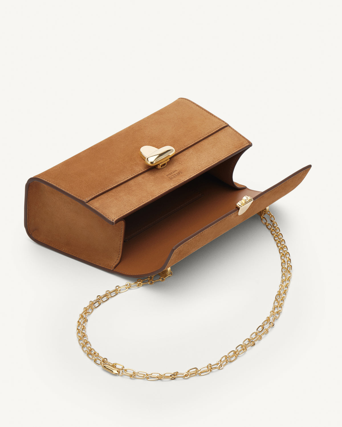 Inside view of saddle suede leather crossbody with gold chain and hardware