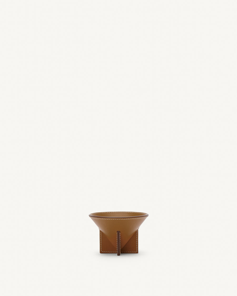 front view of saddle brown leather dish on a white background