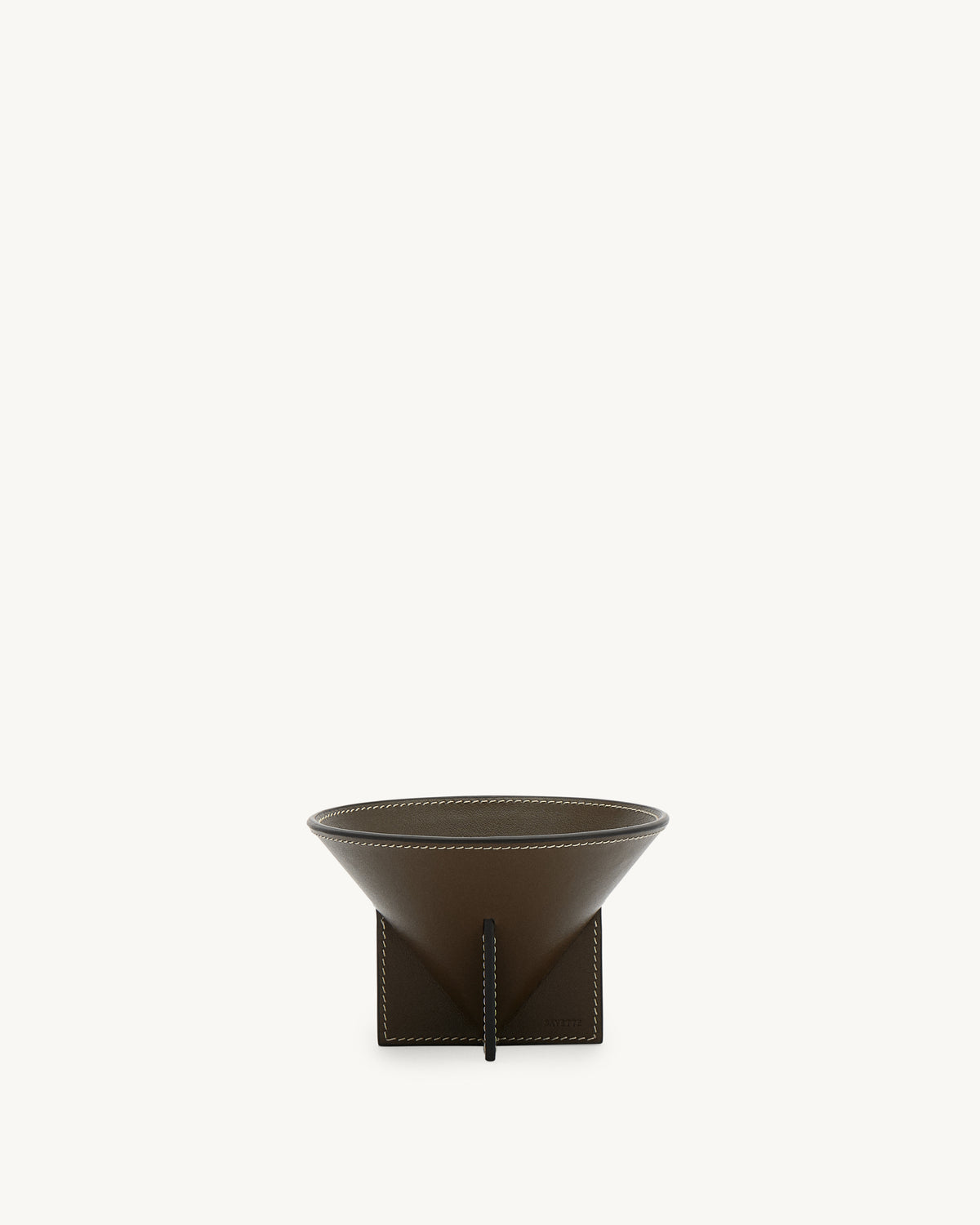 front view of a mink brown leather dish with white stitching on a white background