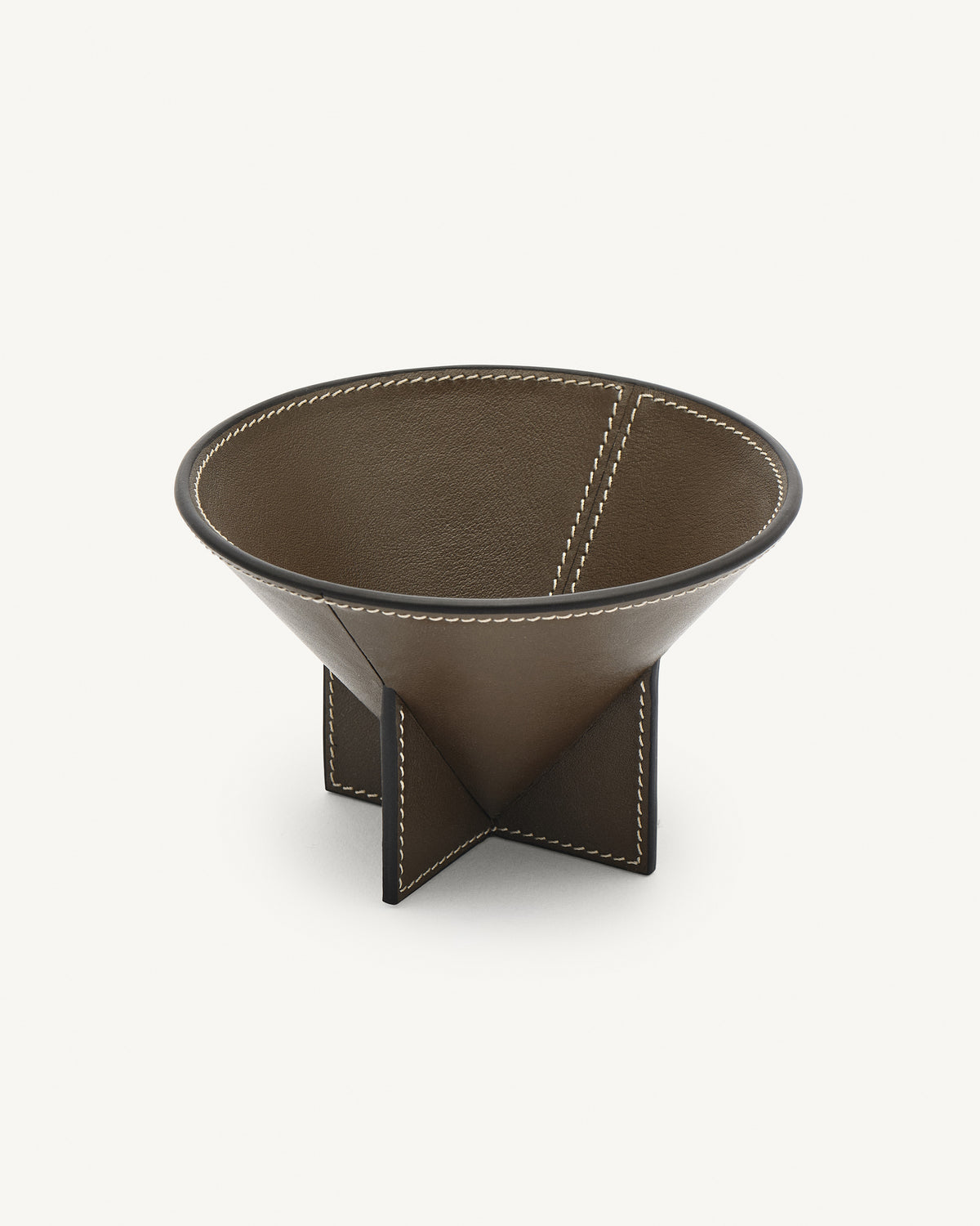 interior view of a mink brown leather dish on a white background