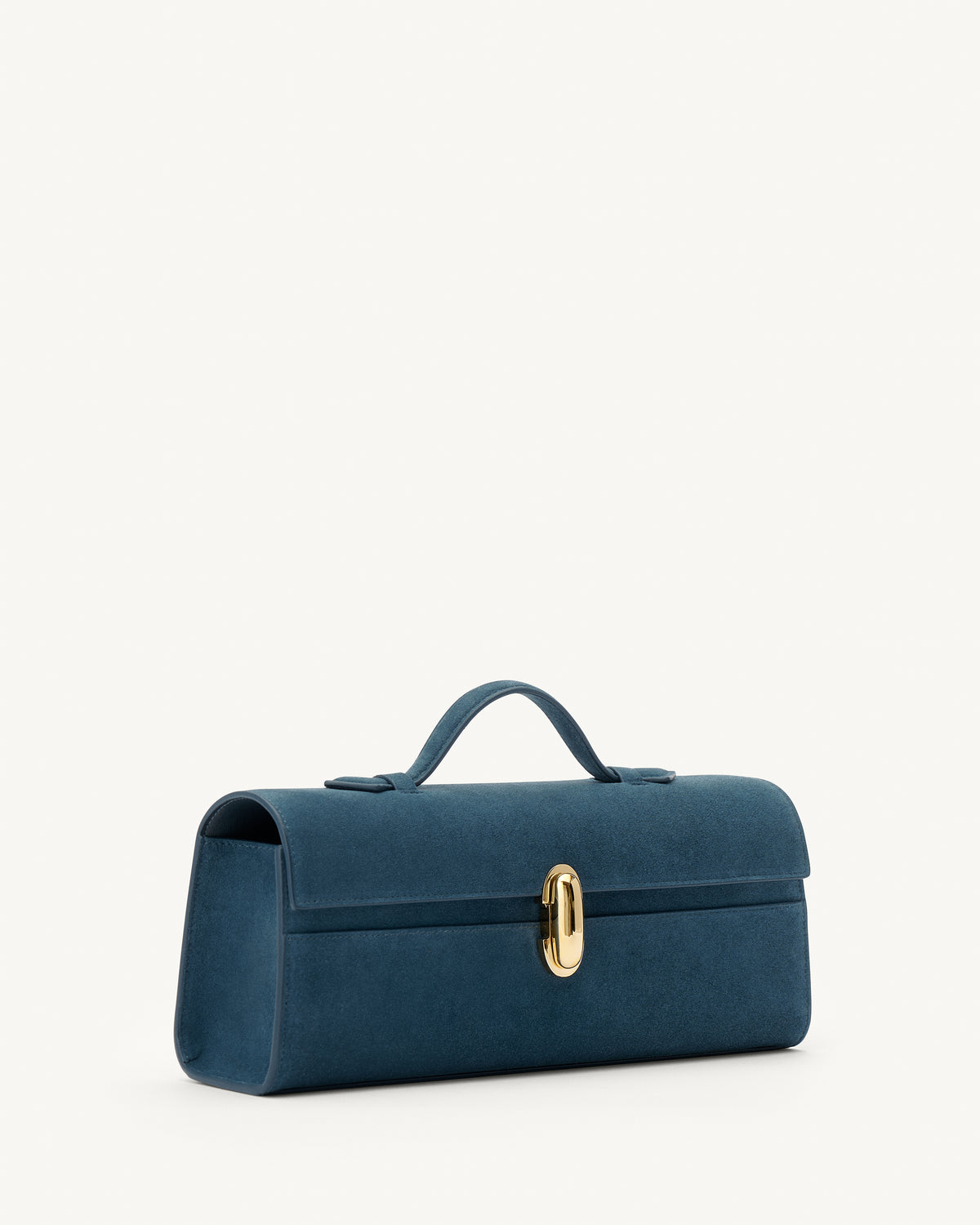 side view of a baltic blue suede top handle bag with a gold clasp on a white background 