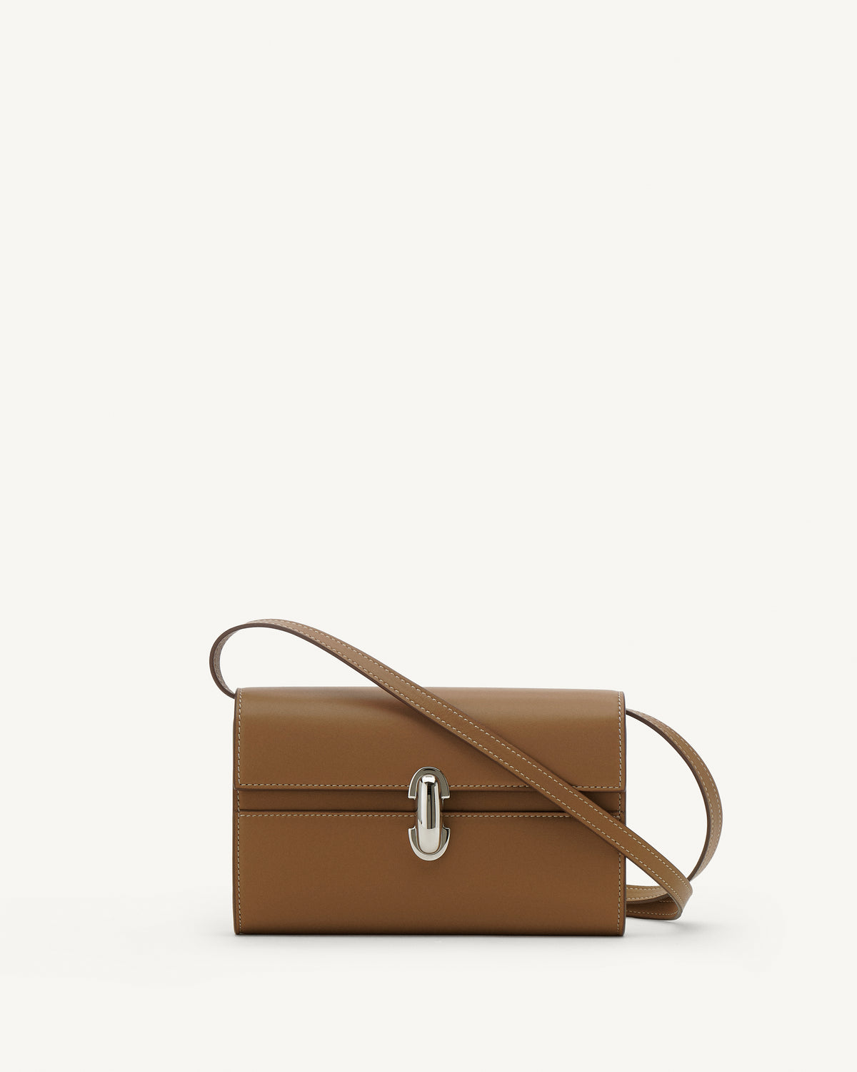 Front view of saddle leather handbag with silver hardware and a crossbody strap on a white background