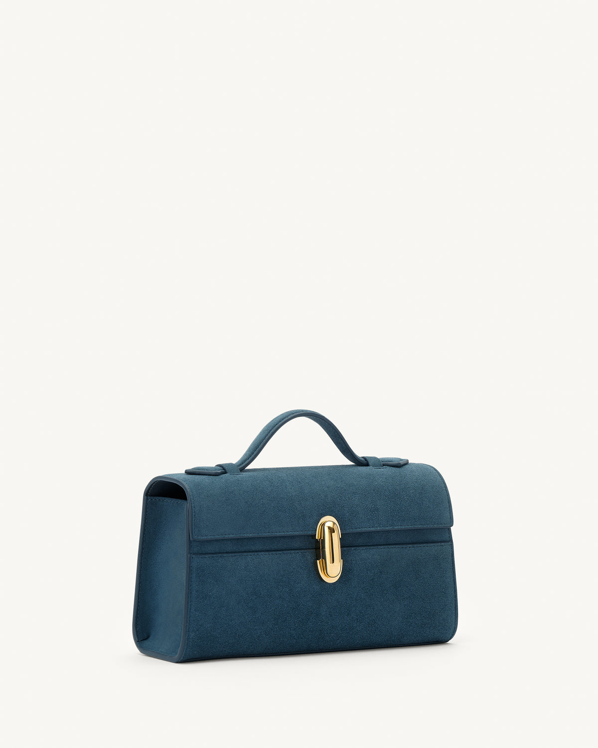 side view of a baltic blue suede top handle bag with a gold clasp on a white background 