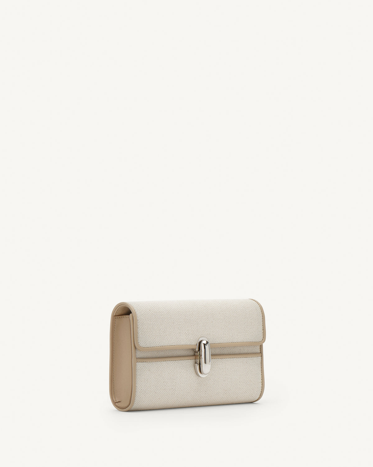 Side view of white canvas crossbody with silver hardware