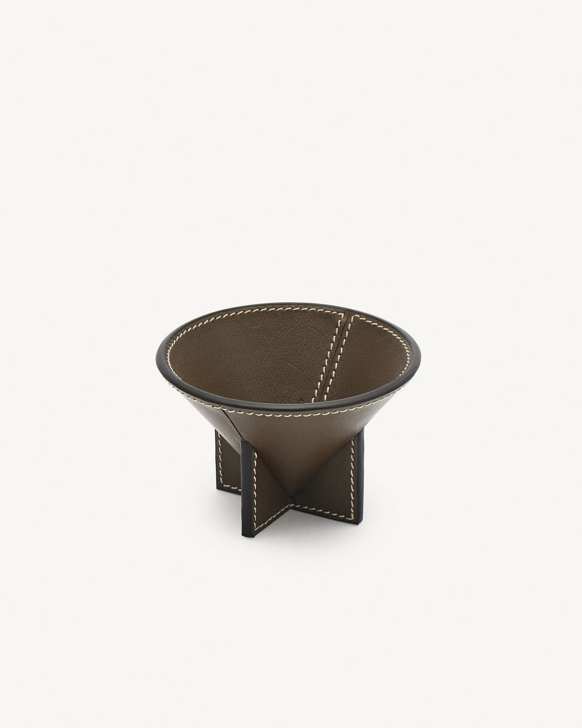 interior view of a mink brown leather dish on a white background