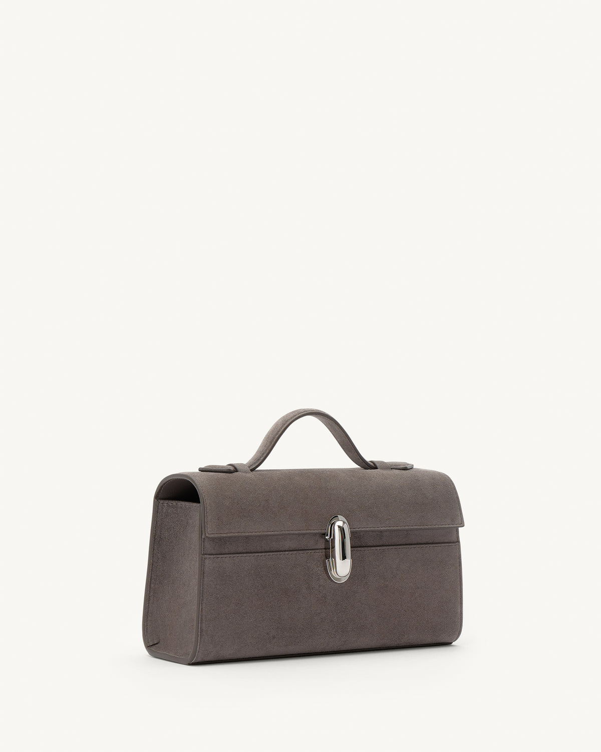 side view of a smoke grey suede top handle bag with a silver clasp on a white background