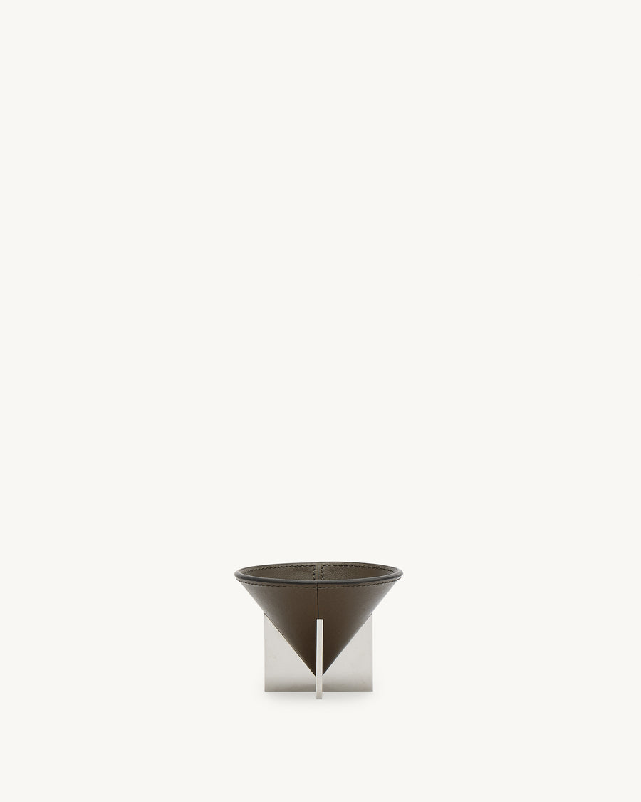 front view of a mink brown leather dish with silver metal feet on a white background