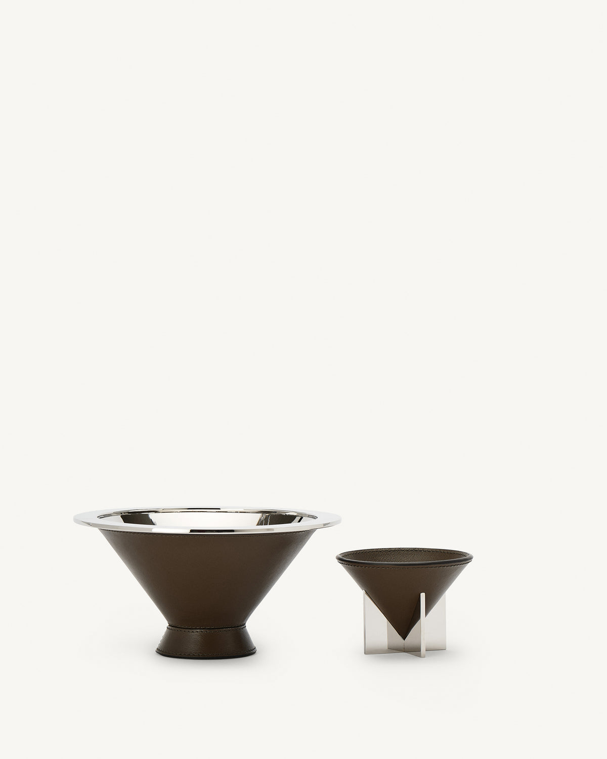 front view of two mink brown leather dishes on a white background