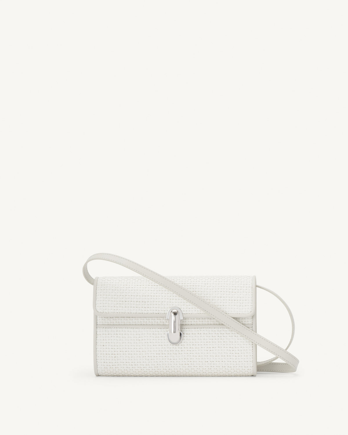 front view of an ivory raffia bag with leather trim with a silver clasp on a white background