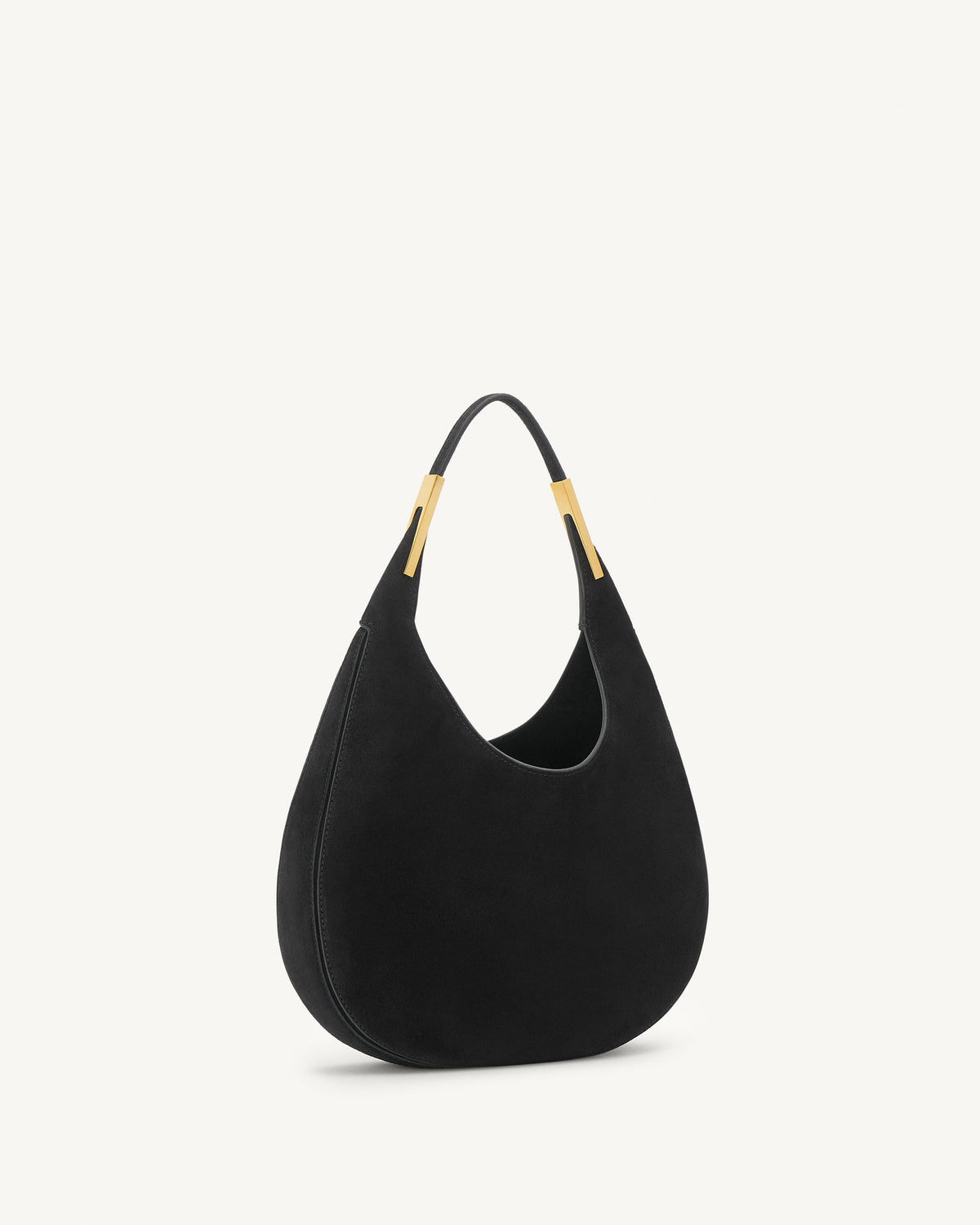 side view of a black suede bag with gold hardware on a white background