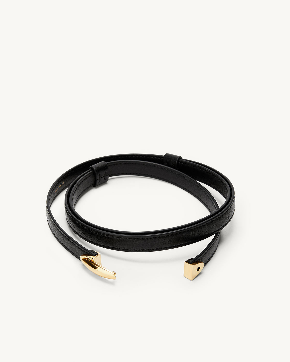 front view of an open black belt with a gold clasp on a white background