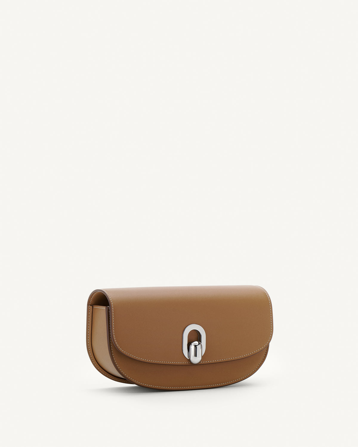Side view of saddle leather crossbody with silver hardware