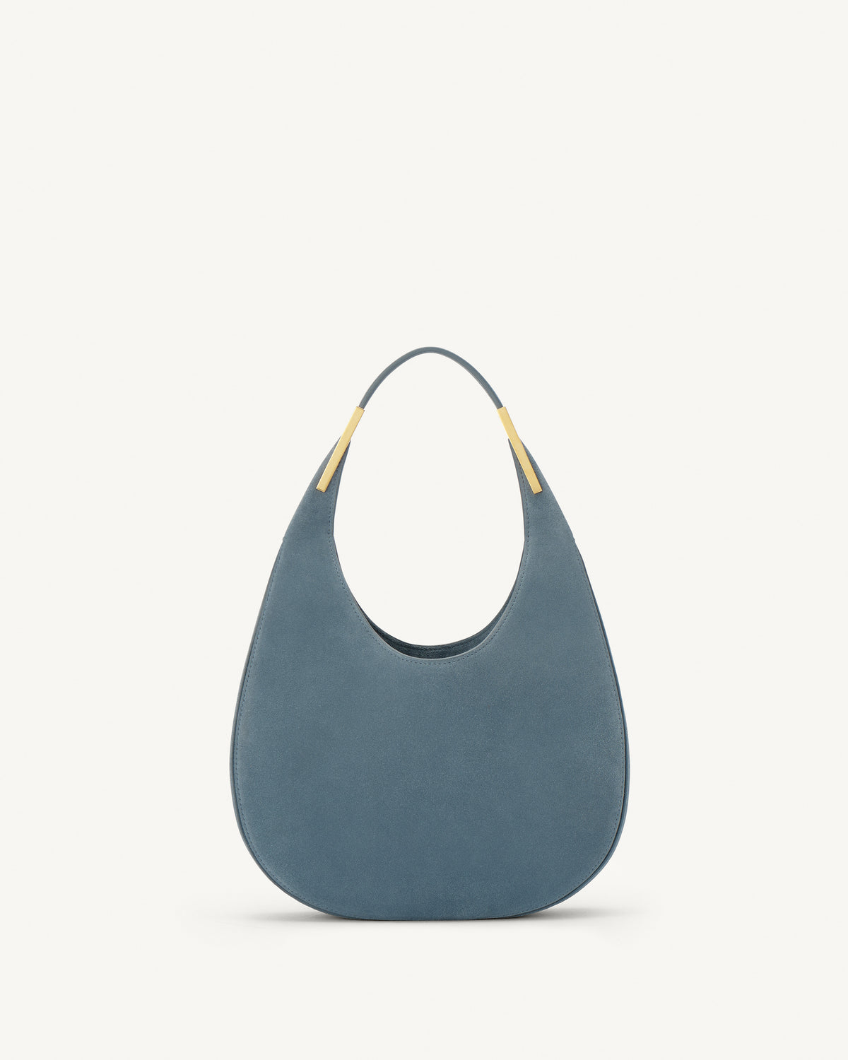 front view of a denim blue suede bag with gold hardware on a white background