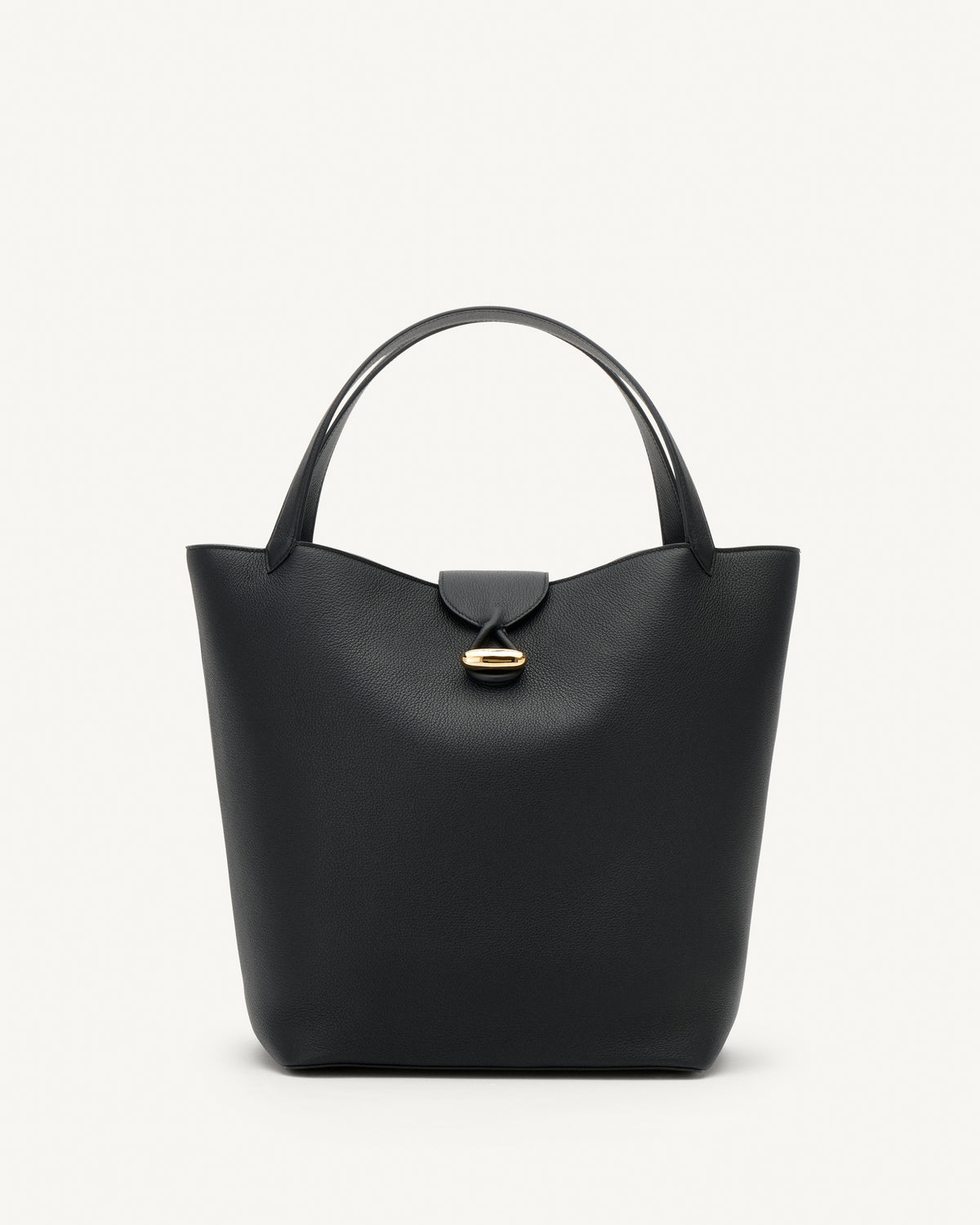 front view of a black tote bag with gold hardware on a white background