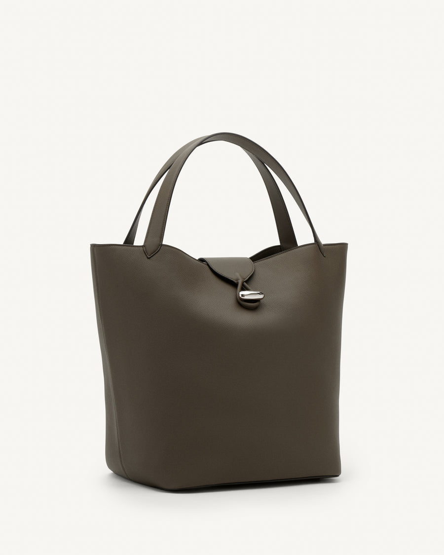 Side view of mink leather tote bag with silver hardware