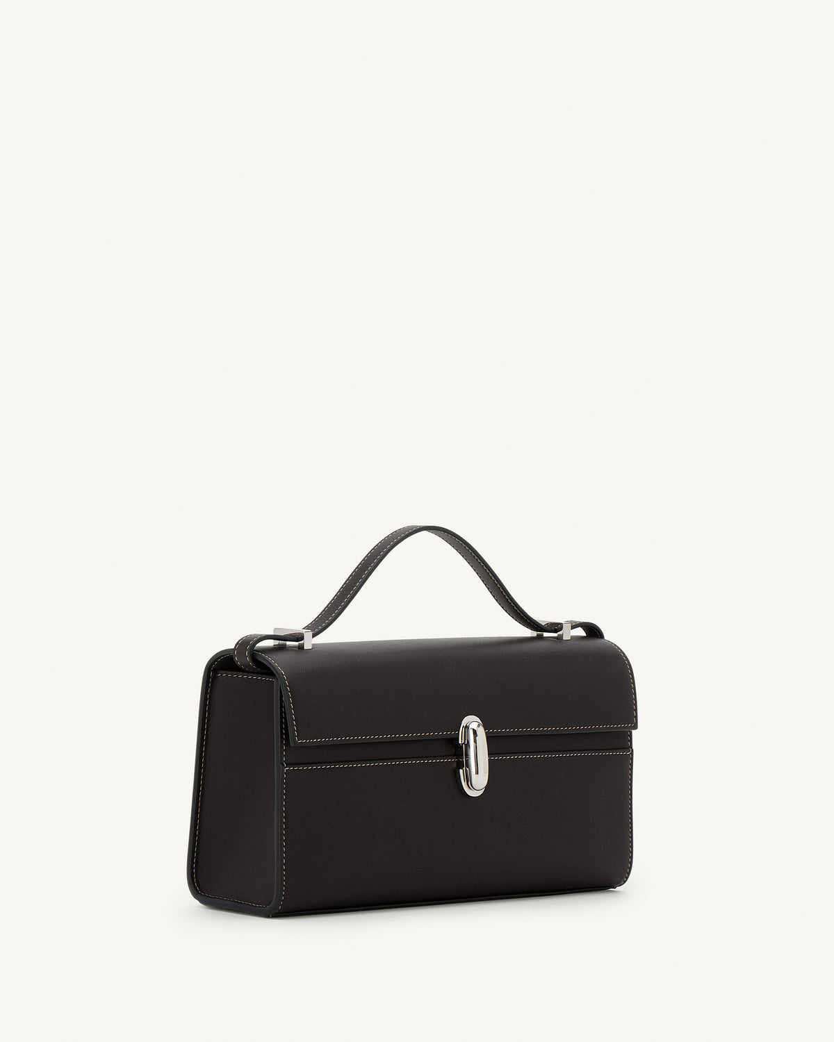 side view of a currant brown bag with silver clasp on a white background