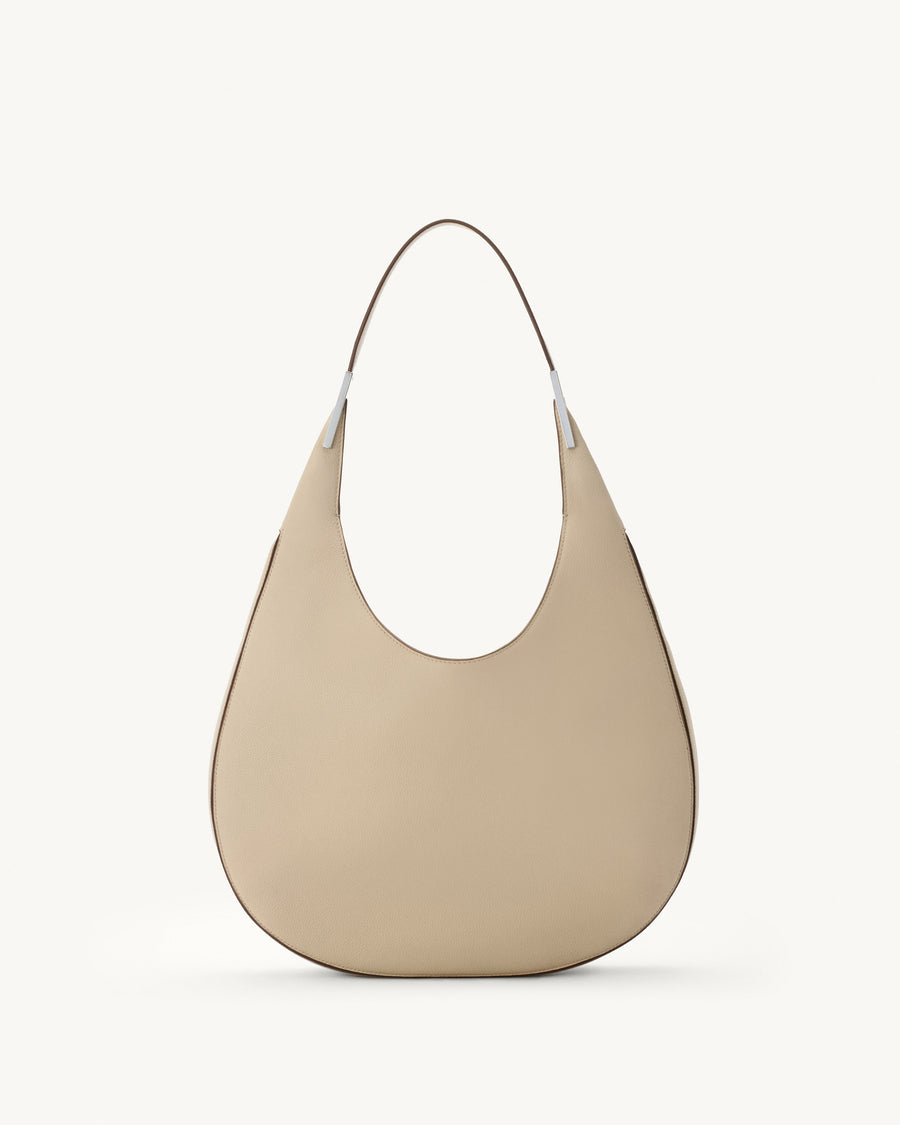 front view of bone beige bag with silver hardware on a white background