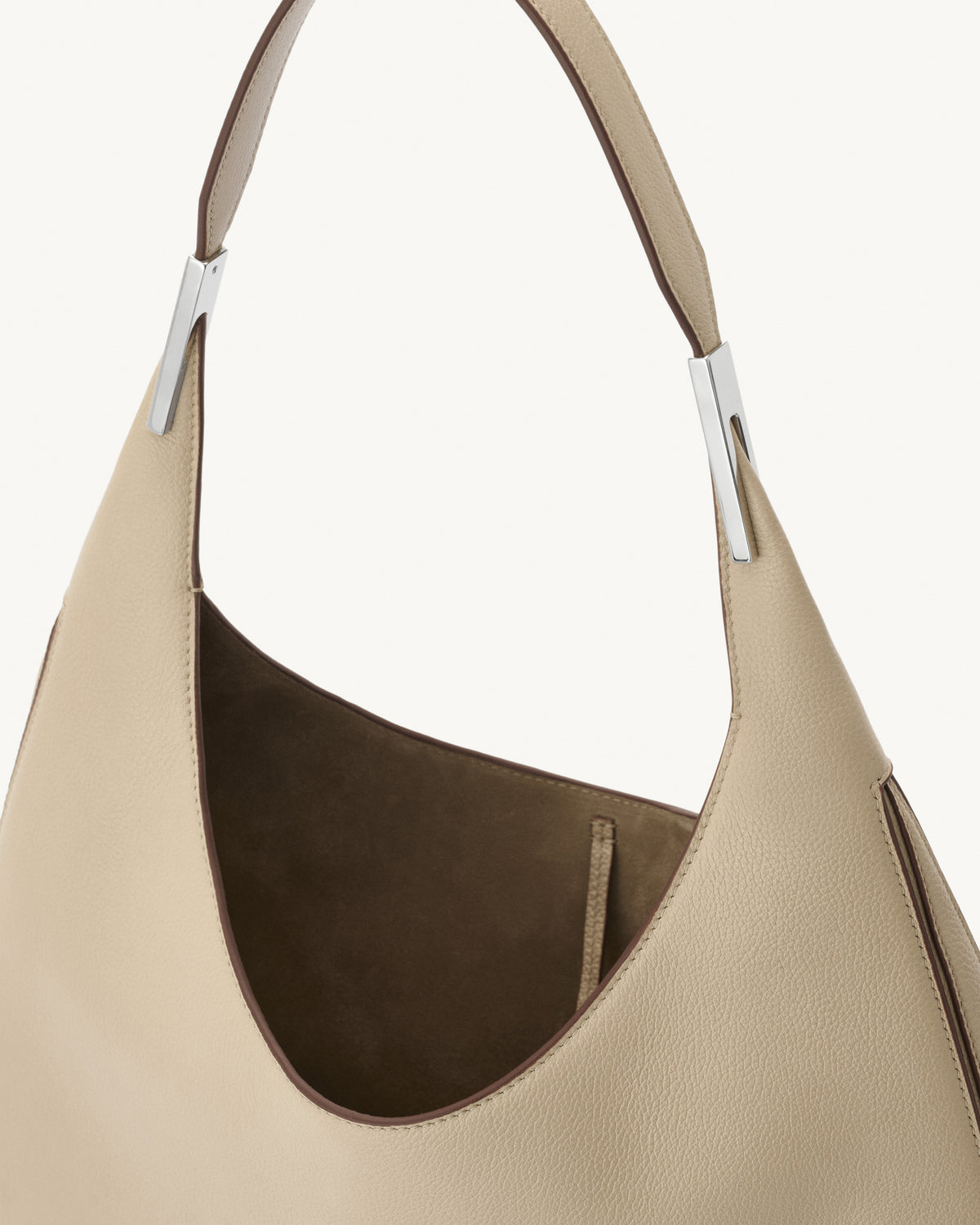 interior view of bone beige bag with silver hardware on a white background