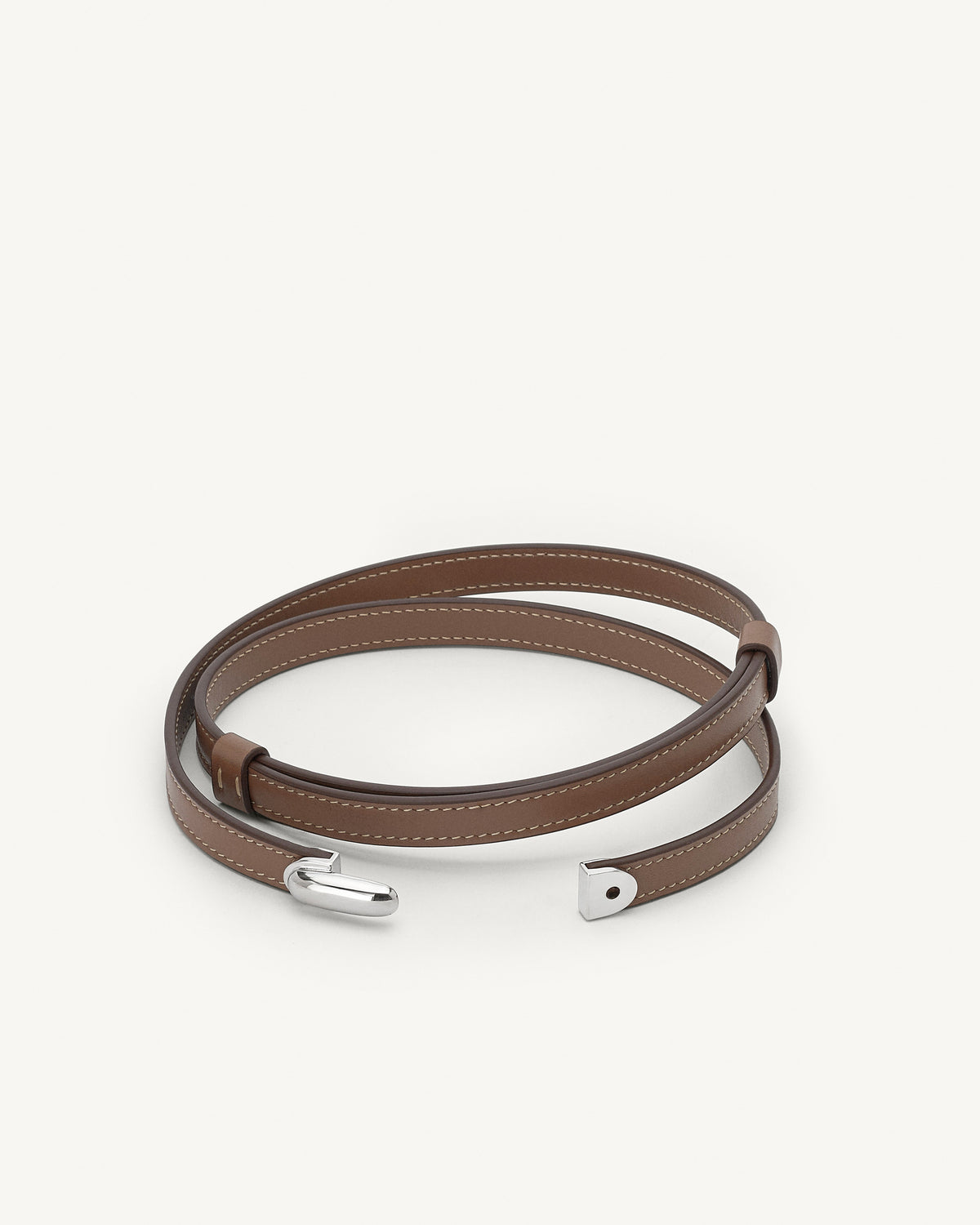 front view of a taupe brown belt with silver clasp on a white background