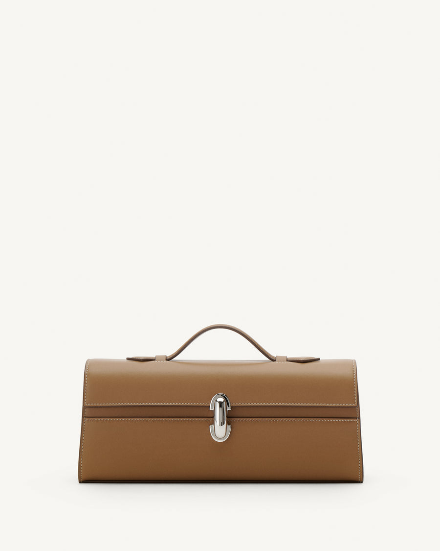 Front view of Saddle leather handbag with a silver clasp on a white background