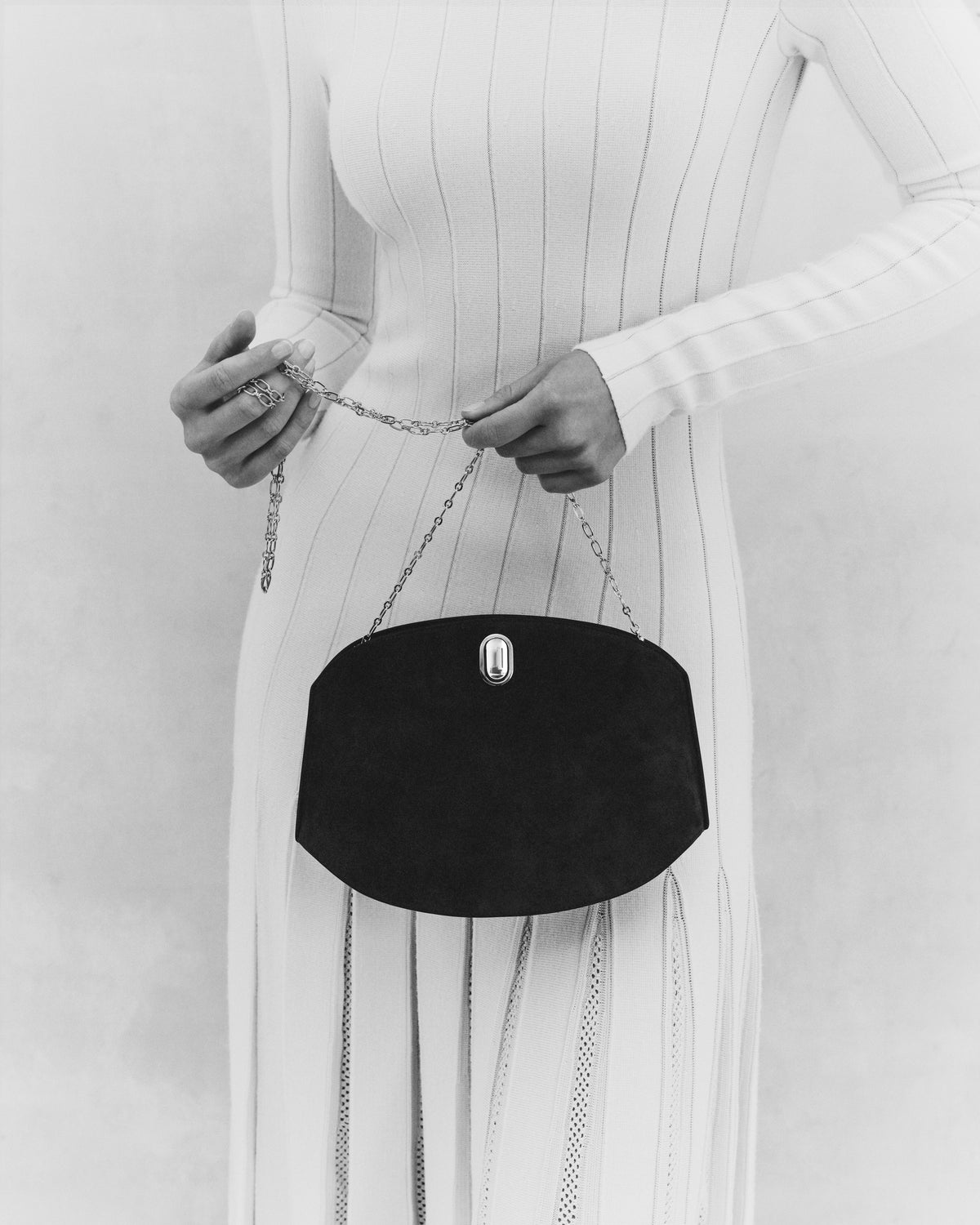black and white on model bag with silver clasp and chain