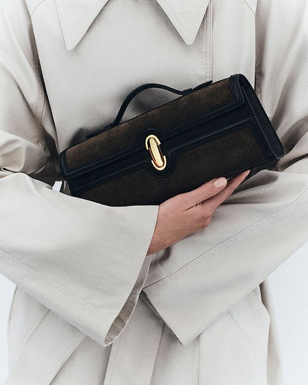 on model view of mink brown bag with gold clasp