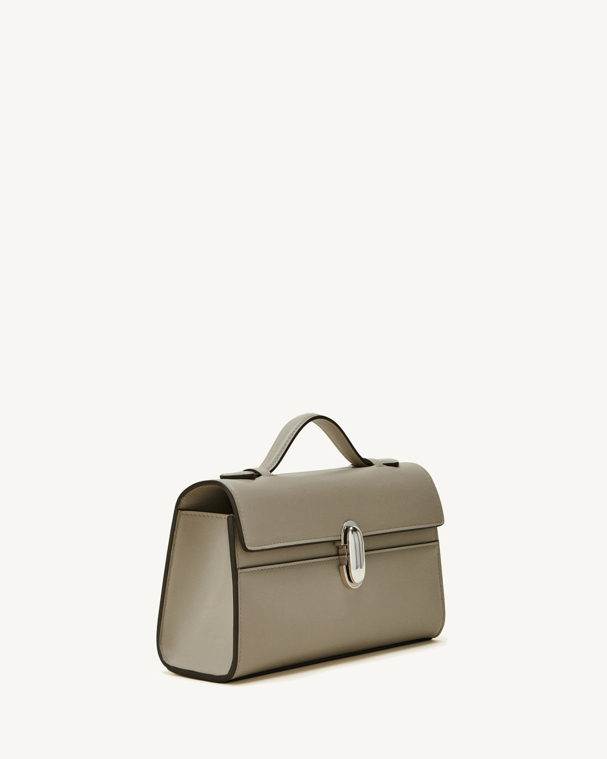 side view of a clay beige bag with a silver clasp on a white background