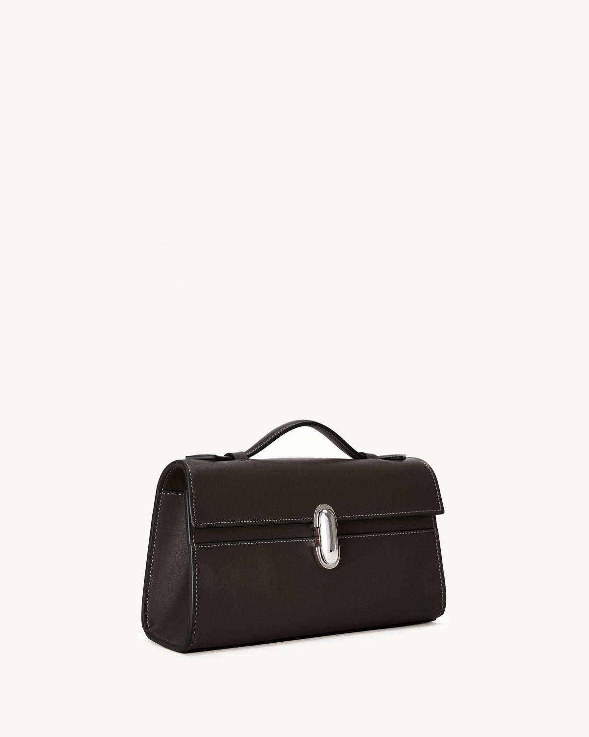 side view of a currant brown bag with silver clasp on a white background